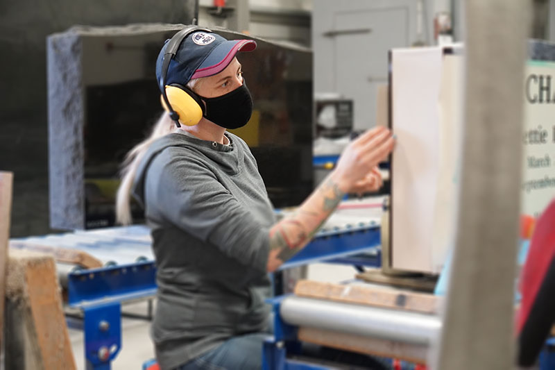 worker crafting a monument - edmonton granite memorials